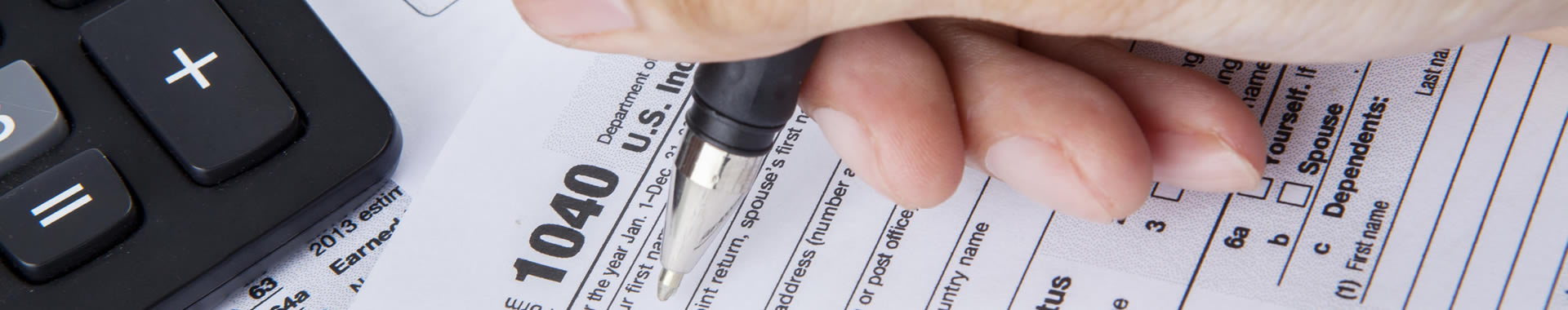 An image of a tax form depicts the concept of tax preparation.